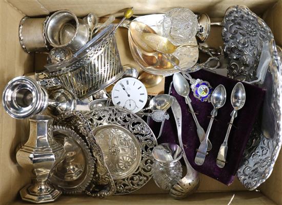 A Victorian repousse silver dish and a quantity of silver and other items including candlestick, caster and spoons.